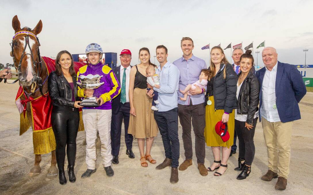 WINNERS ARE GRINNERS: Kate Hargreaves, Alex Ashwood and the winning connections of Don't Care after the trotter's Group One win. Picture: STUART McCORMICK