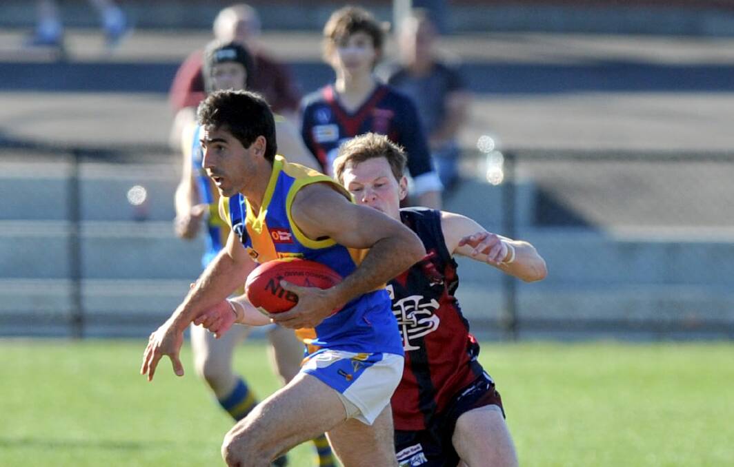 Simon Rosa leads the way to the ball in the 2012 qualifying final.