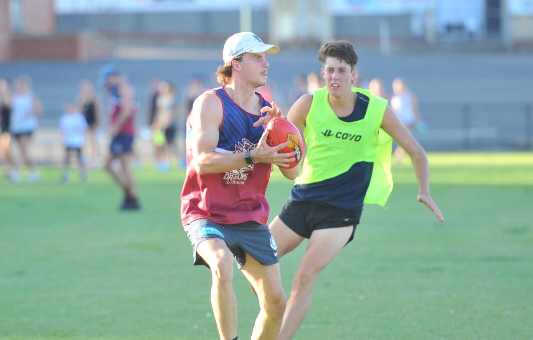YOUNG GUN: Sean O'Farrell takes a mark at Sandhurst training on Wednesday night. Picture: ADAM BOURKE