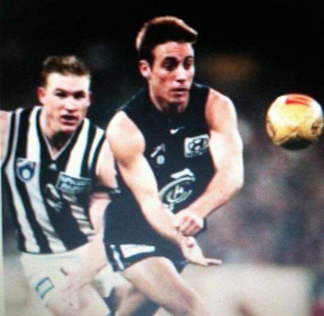 Damien Lock playing for Carlton against Collingwood in 1998.