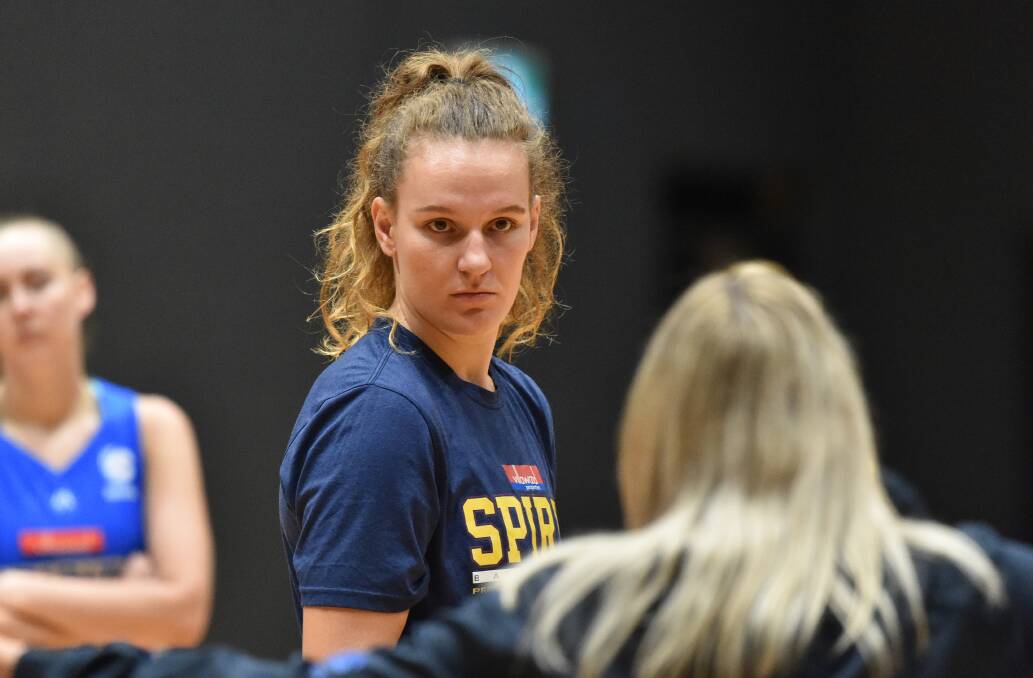 Meg McKay listens intently to coach Tracy York. Picture: NONI HYETT
