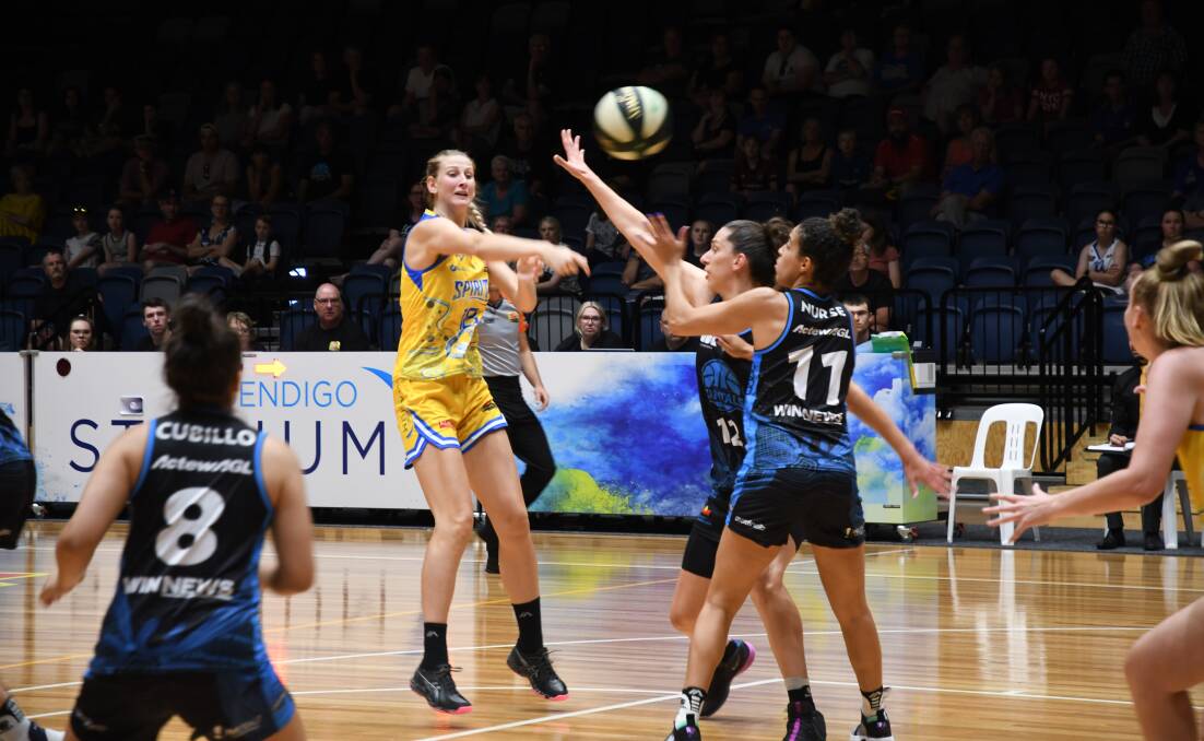 Carly Ernst fires off a pass against the Capitals. Picture: ADAM BOURKE