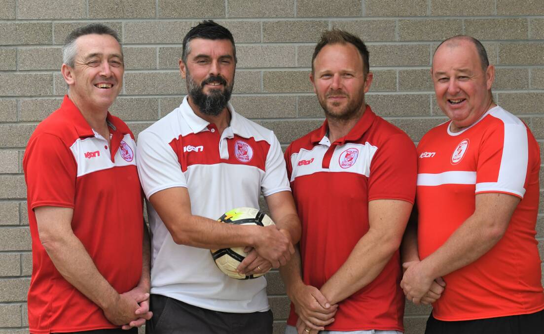 GO REDS: Division two coach Grant Lane, division one coach Tony McQuillan, youth coach Marcus Dawson and women's coach Simon Smith. Picture: ADAM BOURKE