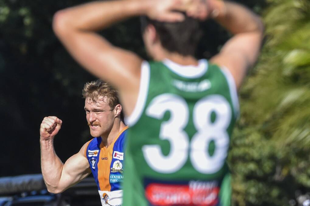 AGONY AND ECSTASY: Kangaroo Flat's Patrick Murphy puts his hands on his head as Square's Jayden Burke celebrates one of his six goals. Picture: DARREN HOWE