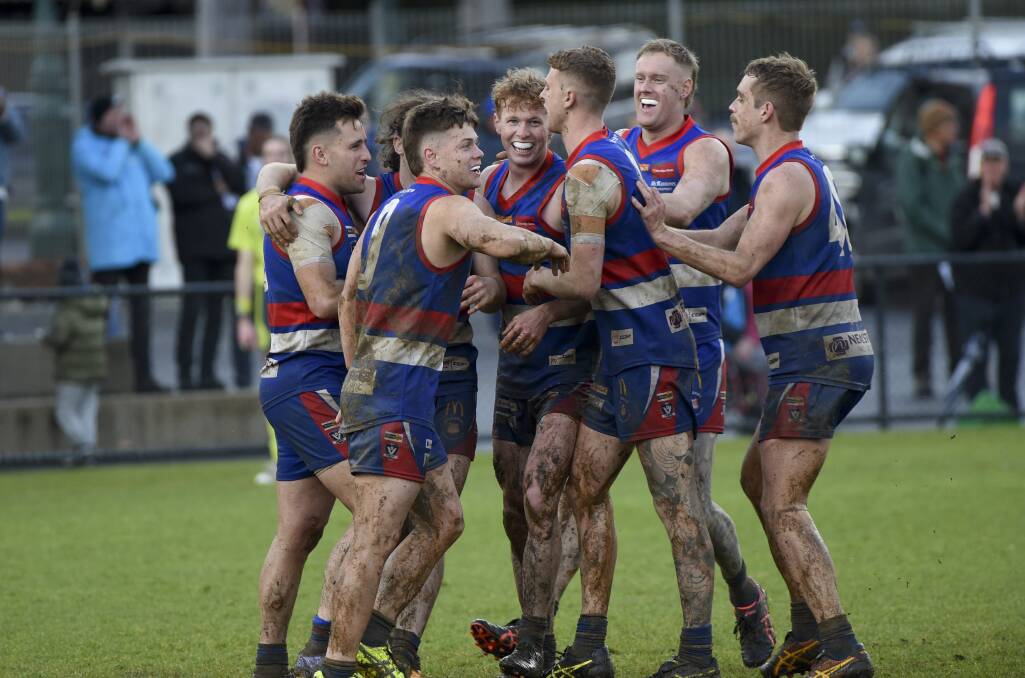 Winners are grinners - Gisborne players celebrate. Picture by Noni Hyett