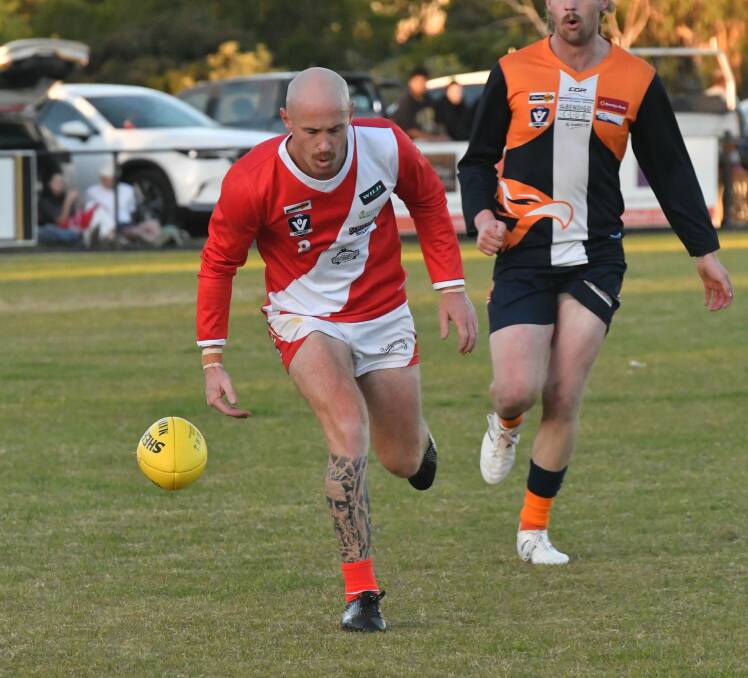 Lachlan Sharp leads the race for the ball against MGYCW.
