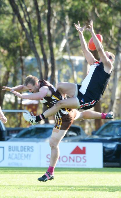 FALCON: This marking attempt slipped through the fingers in the Huntly versus Heathcote game. Picture: DARREN HOWE