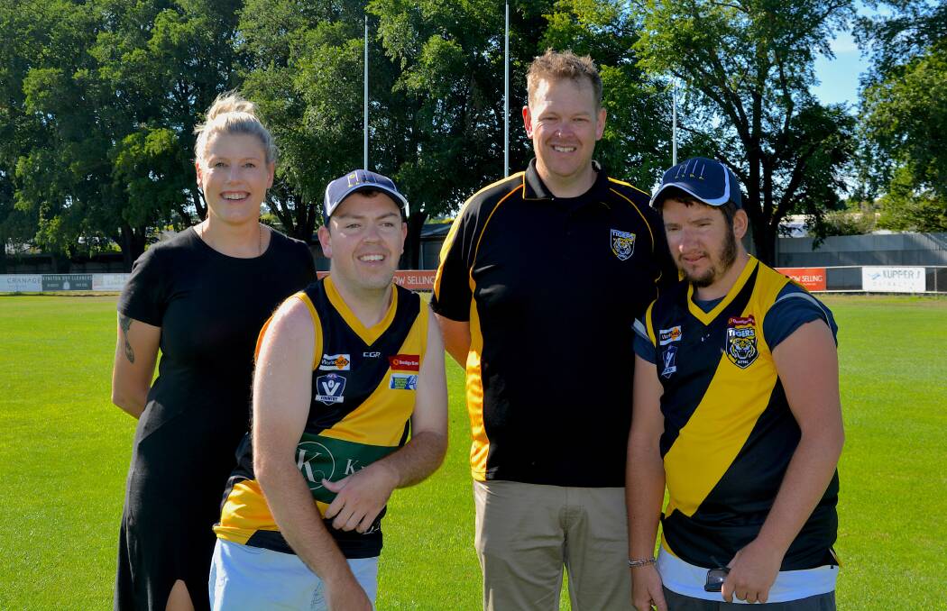 TIGER TIME: FIDA's Elle Dow, Kyneton FIDA players Hayden Walsh and Zander Blanden and club president Hayden Evans. Picture: CONTRIBUTED