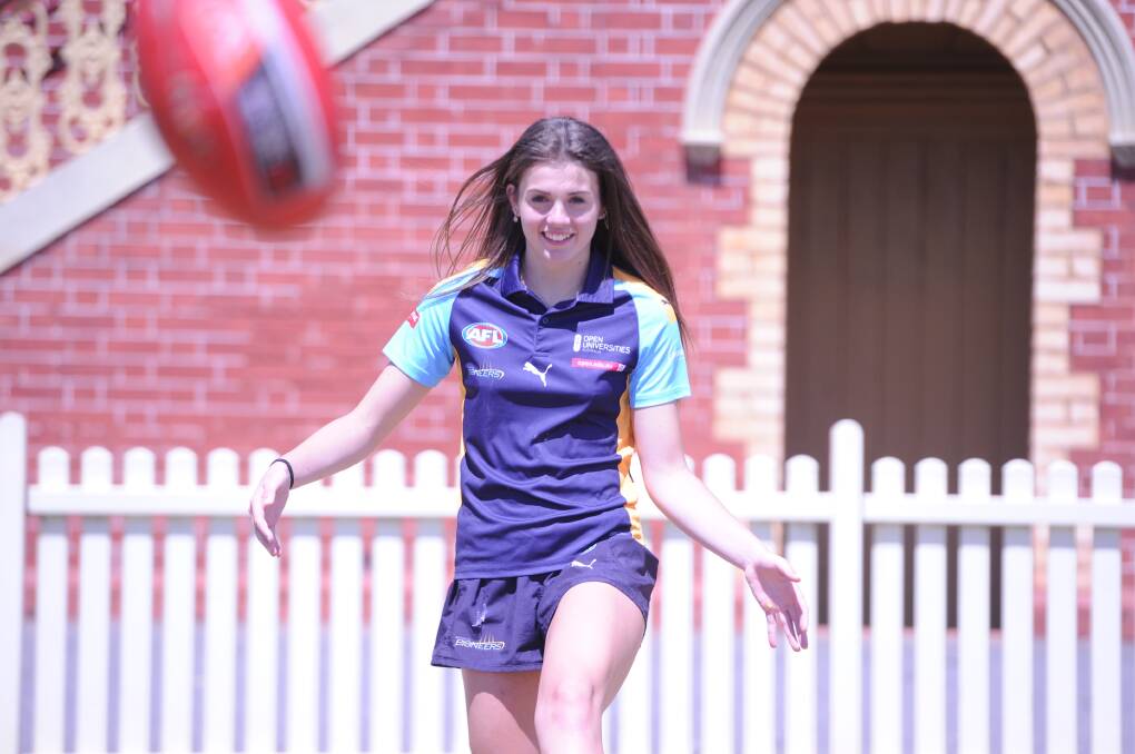 FOOTY FANATIC: Bendigo Pioneers' player Tara Slender works on her skills at the Queen Elizabeth Oval. Picture: ADAM BOURKE
