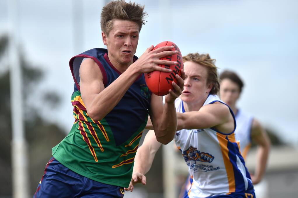 MEMORIES: Fergus Greene playing for CMC in school football in 2016. Later in the year he was drafted by the Western Bulldogs. Picture: NONI HYETT