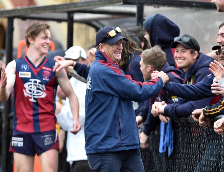 Wayne Primmer with Sandhurst fans in the dying minutes of the 2016 grand final.