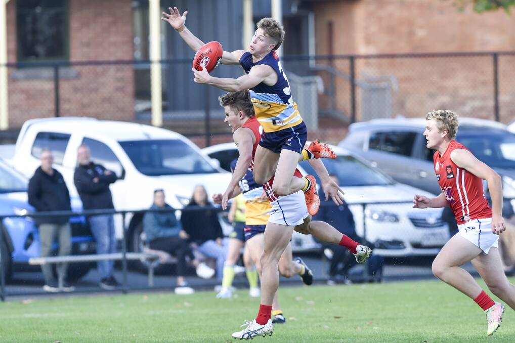 UP AND OVER: The Bendigo Pioneers' Solomon McKay flies high in a bid to take a mark in Sunday's NAB League game at the QEO. Pictures: DARREN HOWE