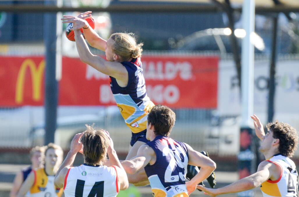 ATHLETIC: Forward MItchell Hallinan jumps high in a bid to take a mark for the Bendigo Pioneers.