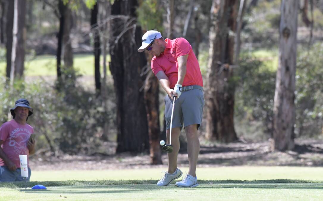 Andrew Martin launches a tee shot on the par-five fifth. Picture: NONI HYETT