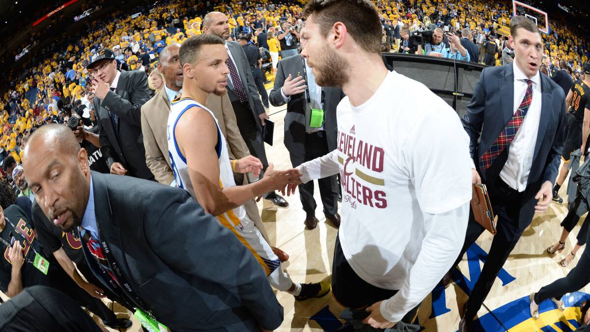 Matthew Dellavedova and Steph Curry after the Cavs defeated the Warriors to win the 2016 NBA CHampionship. Picture: GETTY