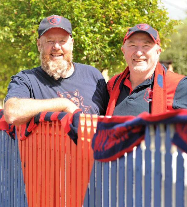 GO DEES: Stuart Balnaves and Shane Meade are ready to cheer on Melbourne in Saturday night's AFL grand final. Picture: ADAM BOURKE