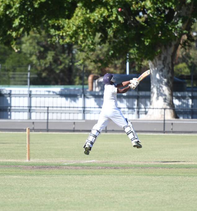 Chathura Damith gets airborne to play a cut shot for four. Picture: ADAM BOURKE