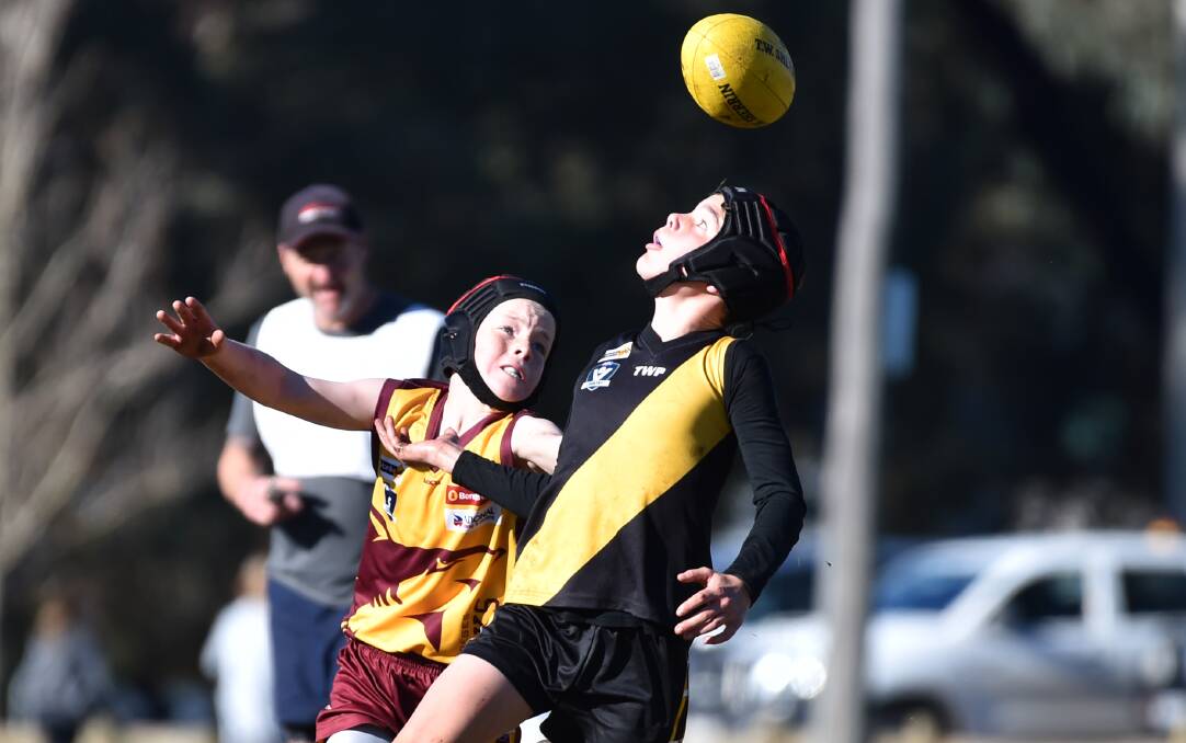 EYES ON THE BALL: Kyneton and St Therese's did battle in the under-12A clash at Ewing Park. Picture: GLENN DANIELS