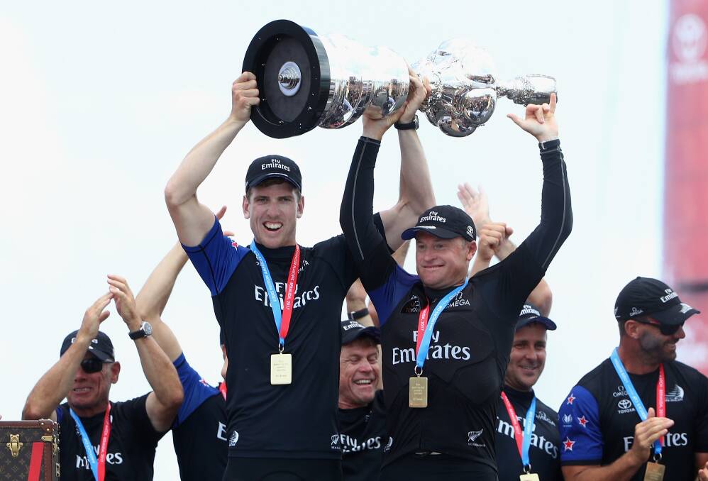 Glenn Ashby and Peter Burling lift the Auld Mug. Picture: GETTY IMAGES