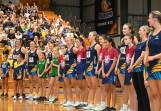 Bendigo Strikers players and junior community club players line up before the start of Sunday's VNL game. Picture by Enzo Tomasiello