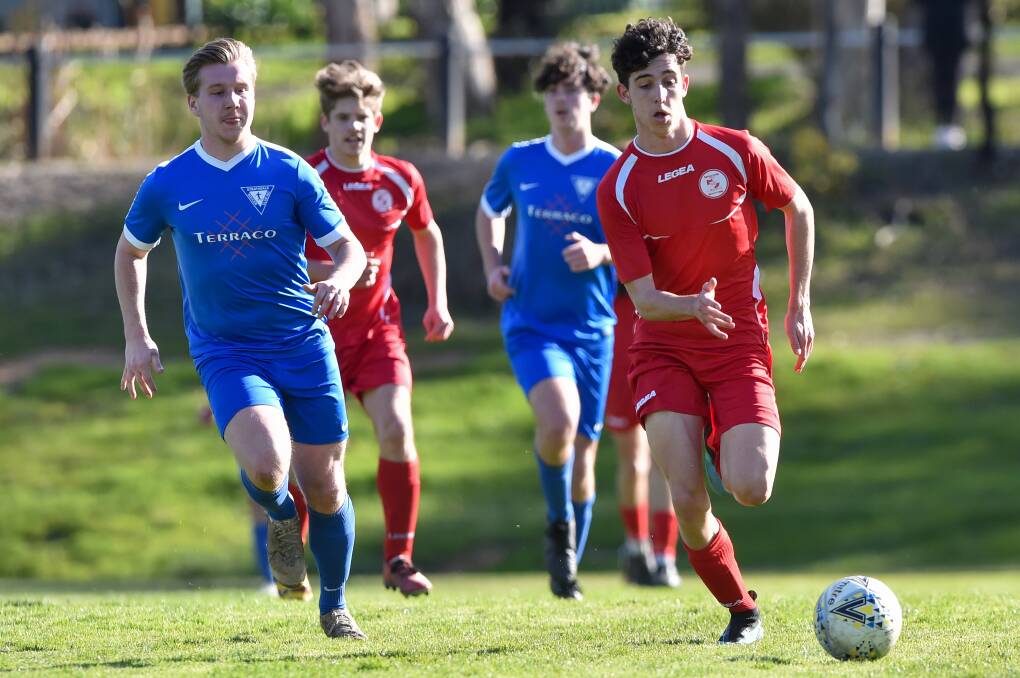 Sam Farr and Will Keating chase down the ball at Besicher Park. Picture: DARREN HOWE