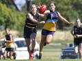 LONG DAY: Bendigo's Lila Keck leads the race for the ball in Sunday's loss to the Murray Bushrangers. Picture: DARREN HOWE