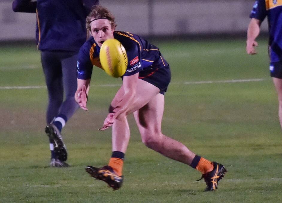 Gisborne star Pat McKenna marks on the lead at BFNL training on Tuesday night. Picture: DARREN HOWE