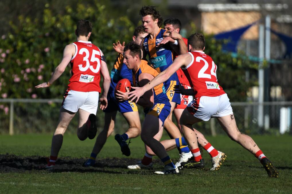 CLEARANCE: Golden Square's Terry Reeves looks for a team-mate after a centre bounce. Picture: ADAM BOURKE
