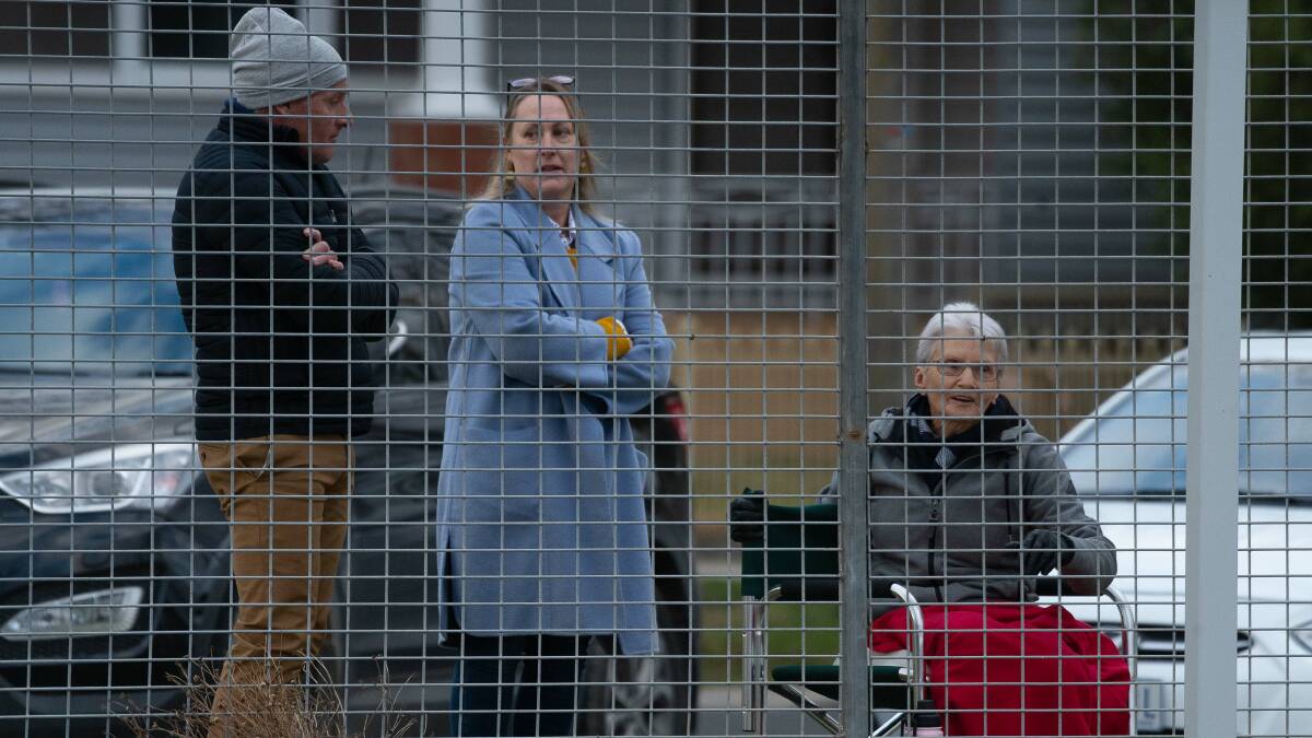 Spectators outside the fence at Wade Street for the Golden Square versus South Bendigo matches.