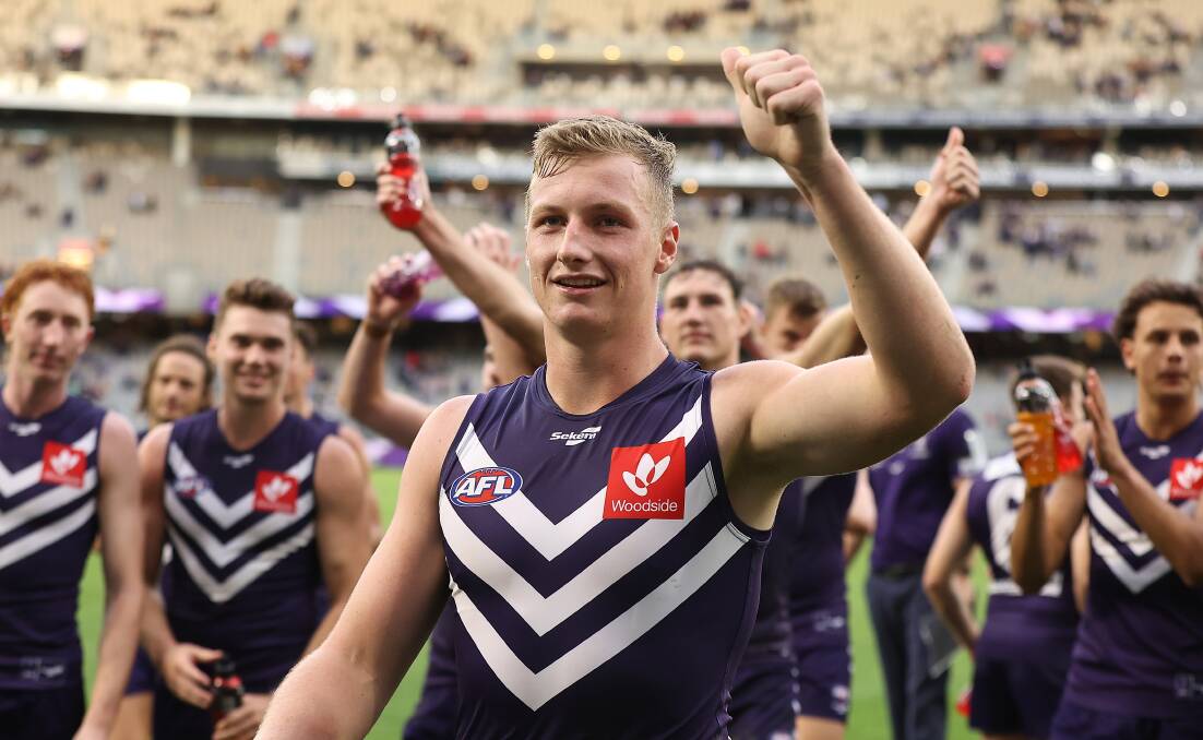 PURPLE PRIDE: Josh Treacy leads the Dockers off the ground after his AFL debut on Sunday. Picture: GETTY IMAGES