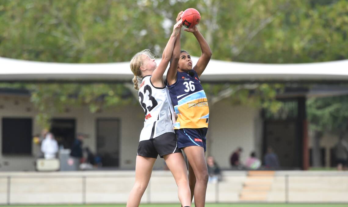GOOD HANDS: Jemika Cooper takes a strong mark for the Pioneers. Cooper will play for the Woomeras in Sunday's feature under-16 match. Picture: NONI HYETT