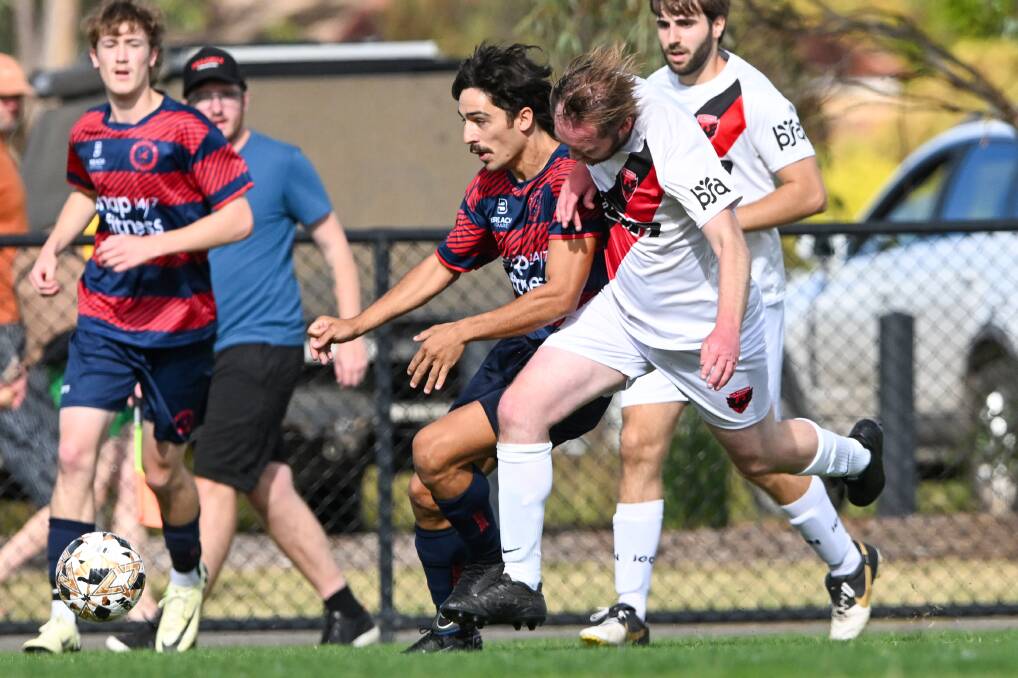 Epsom's Nick Collins surges past the La Trobe Uni defence in Sunday's League Cup round of 16 match. Picture by Darren Howe