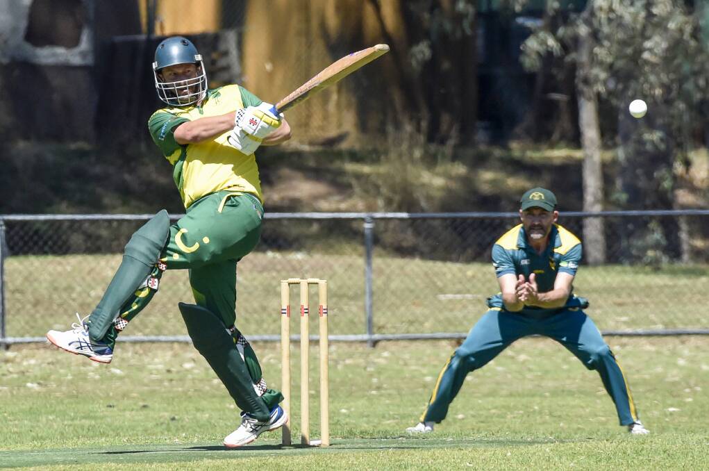 CRUNCH: Emu Creek's SImon Marwood pounds a pull shot against Spring Gully. Picture: DARREN HOWE