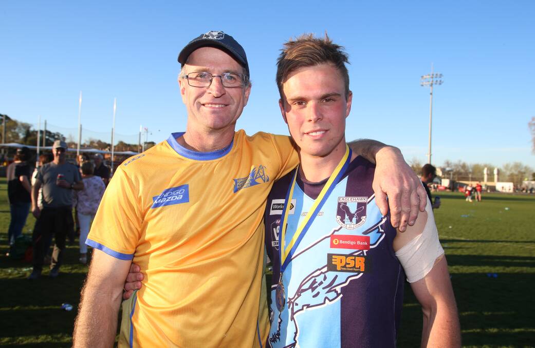 FAMILY PRIDE: Darren and Sam Thompson after Eaglehawk defeated Strathfieldsaye in Saturday's grand final at the Queen Elizabeth Oval. Picture: GLENN DANIELS