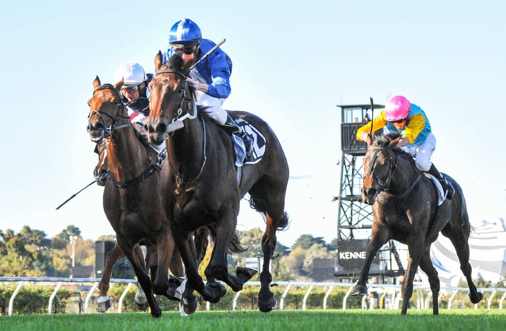 Bendigo mare Super Girl, pink cap, finishes a gallant thid in the Andrew Ramsden Stakes at Flemington on Saturday. Picture: RACING PHOTOS