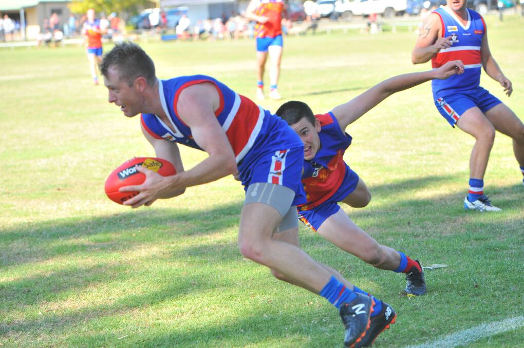 Pyramid Hill's Gavin James tries to get around Marong teenager Will Gadsden. Picture: ADAM BOURKE