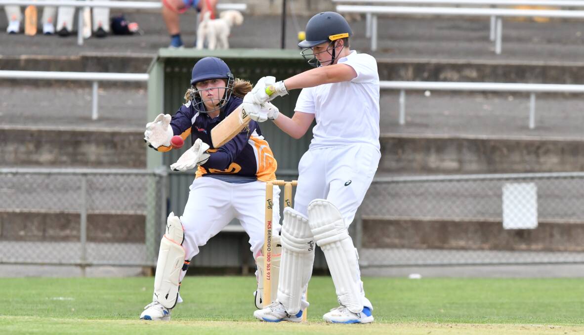 CLOSE CALL: Bendigo under-14 keeper Nick Rowley watches the ball go past the bat of Murray Valley's Hunter Hardiwdge. Pictures: NONI HYETT