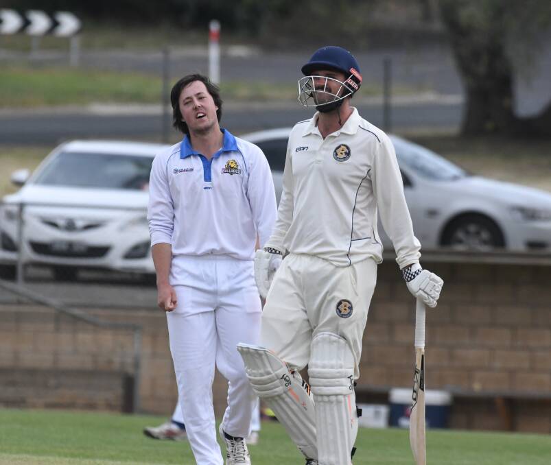 Golden Square's Kayle Thompson apologises to his former captain Nathan Fitzpatrick after a wayward full toss struck the Bendigo skipper in the wrist. Picture: ADAM BOURKE
