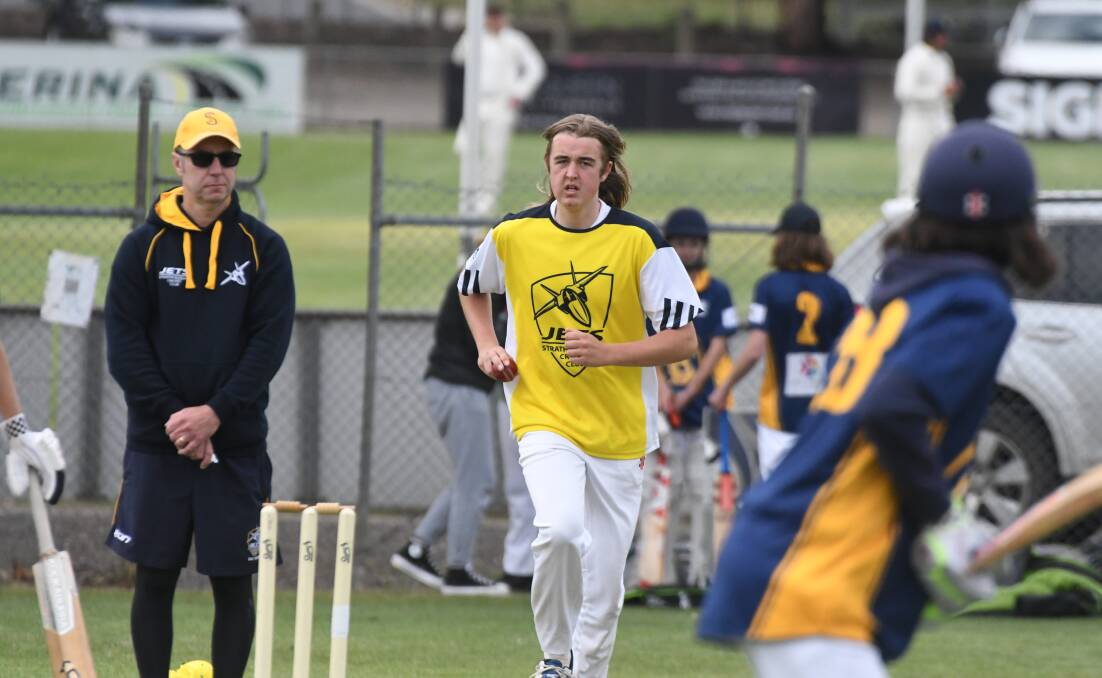 GOOD GAME: Strathfieldsaye's Ned Budde comes into bowl in the under-16 game against Bendigo. Pictures: ADAM BOURKE 