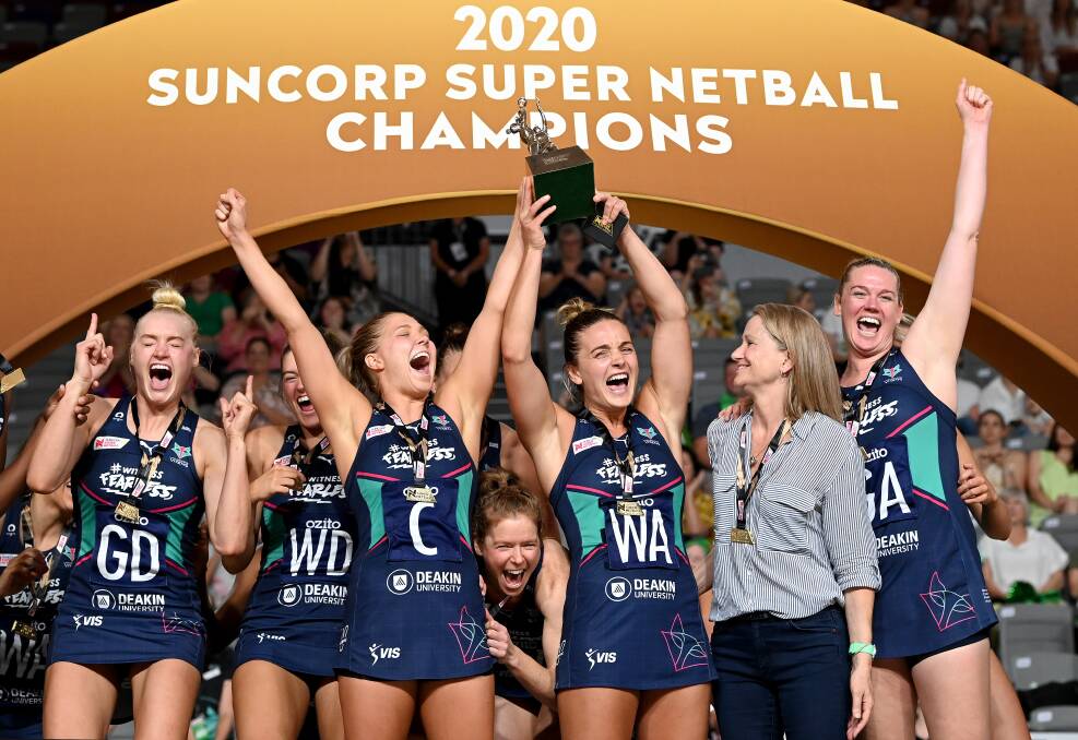 Caitlin Thwaites, right, punches the air in jubilation as the Melbourne Vixens celebrate their grand final win. Picture: GETTY IMAGES