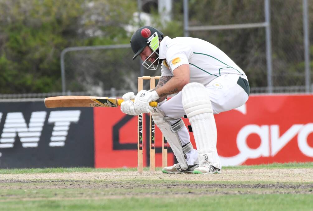 Kangaroo Flat's Josh Collinson is struck on the head by a Chris Sole bouncer. Picture: NONI HYETT