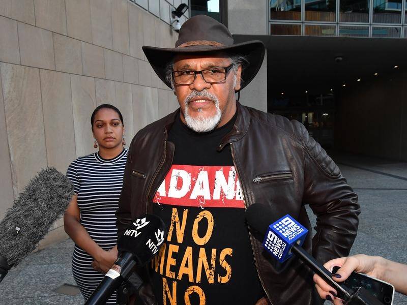 Adrian Burragubba believes Adani wants to silence his opposition to its Queensland coal mine.