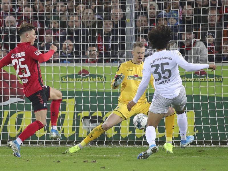 Joshua Zirkzee scored late to restore Bayern Munich's lead in their Bundesliga win at Freiburg.