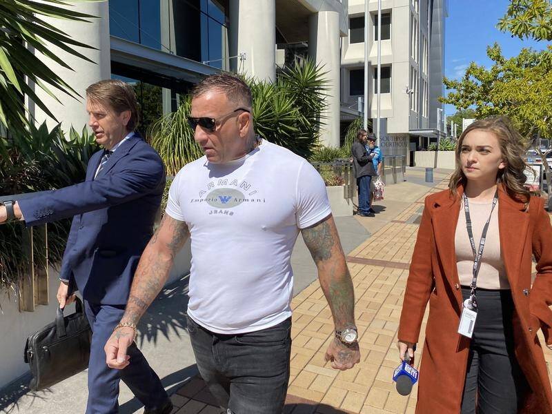 Shane Bowden (C) was shot 21 times with an automatic pistol as he returned to his Gold Coast home.