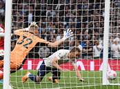Harry Kane scores Tottenham's second goal in Spurs' 3-0 derby win over Arsenal.