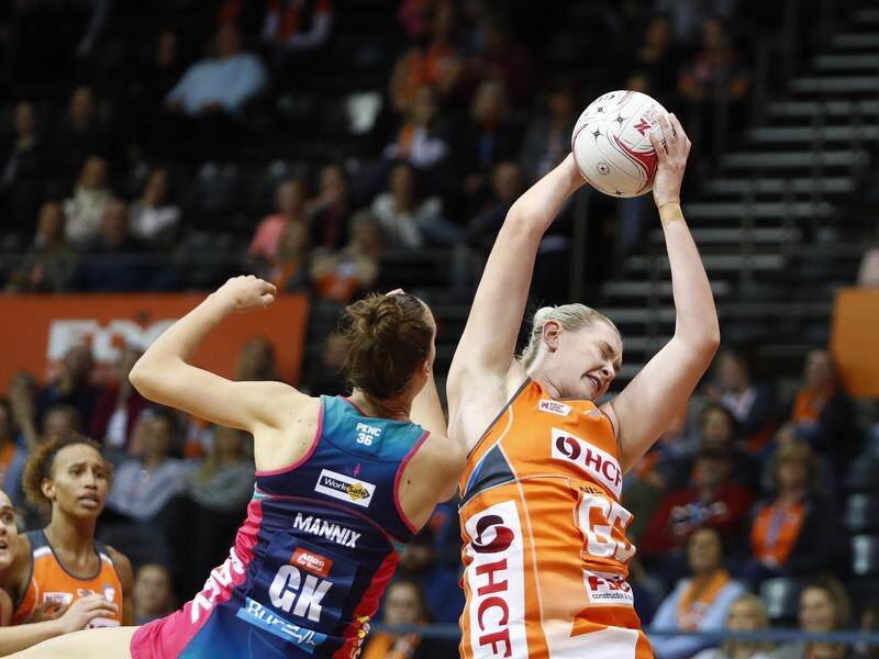 The Giants' Kristina Brice catches the ball under the pressure of Emily Mannix of the Vixens.