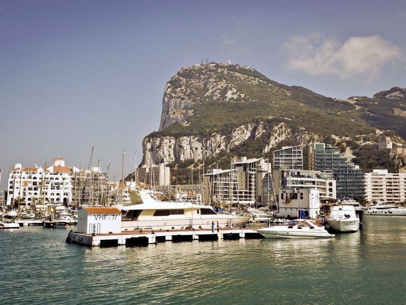 Spain says Madrid must agree on the status of Gibraltar before it backs a draft Brexit deal.
