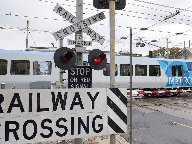Progress on removing level crossings has slowed, amid the cost impact of major road projects. (Ellen Smith/AAP PHOTOS)