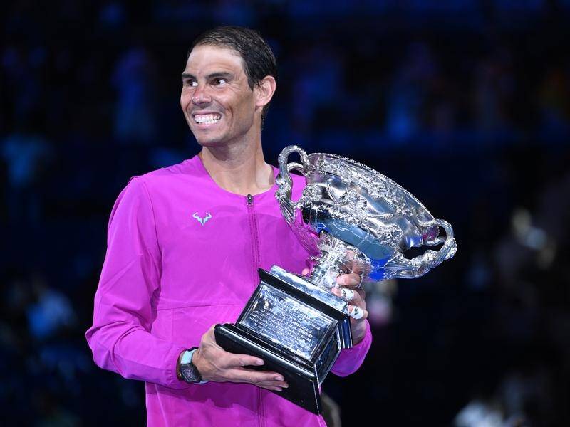 Overjoyed Rafael Nadal holds the Australian Open trophy after his 21st grand slam triumph.