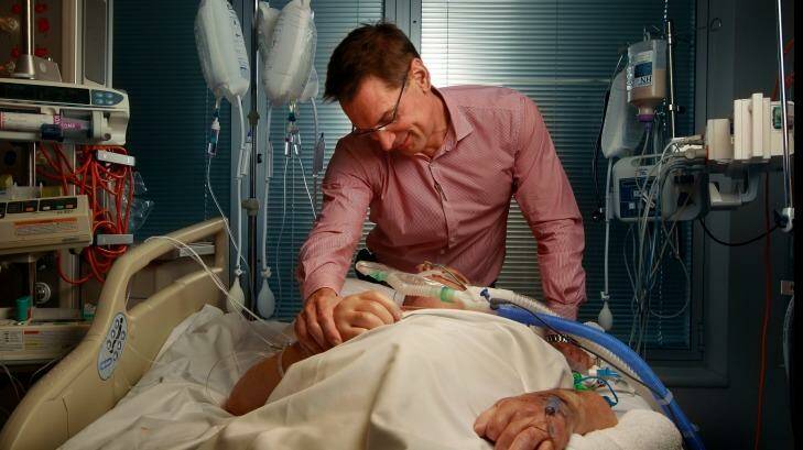 Dr William Silvester with a patient in Intensive Care at The Austin Hospital. Photo: Simon O'Dwyer